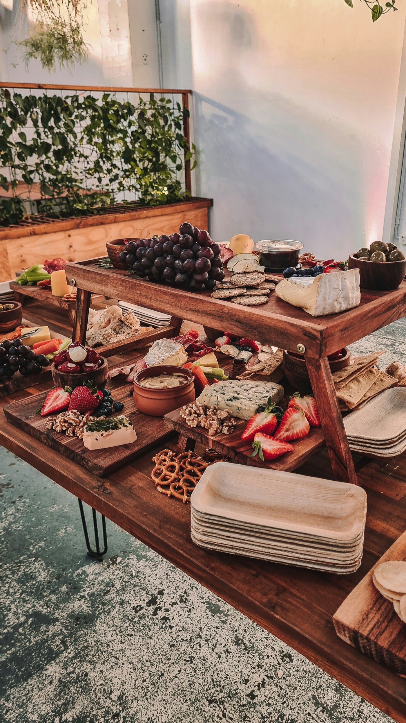 A long grazing table set for a large event.