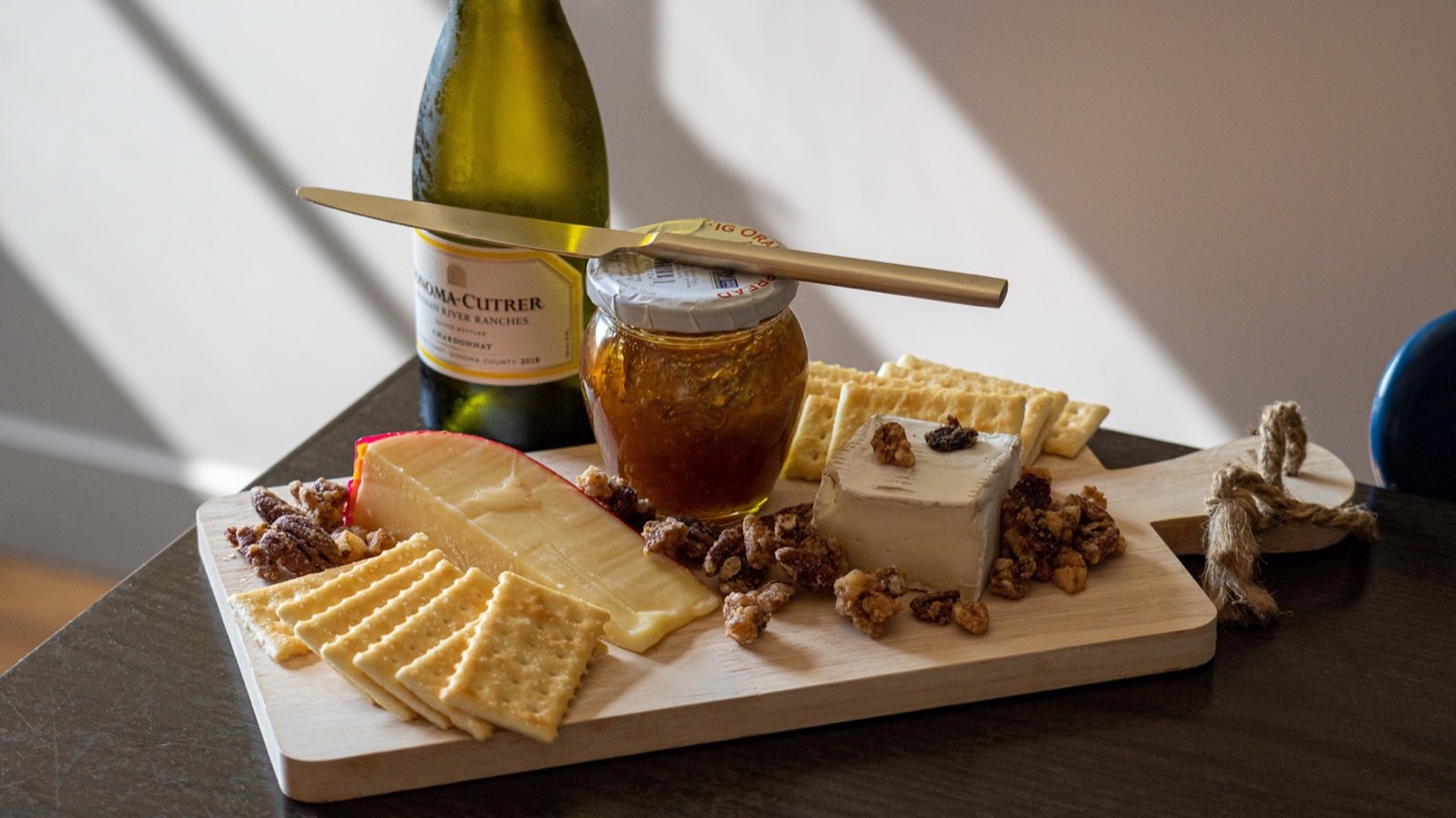 An intimate at-home wine and cheese moment.