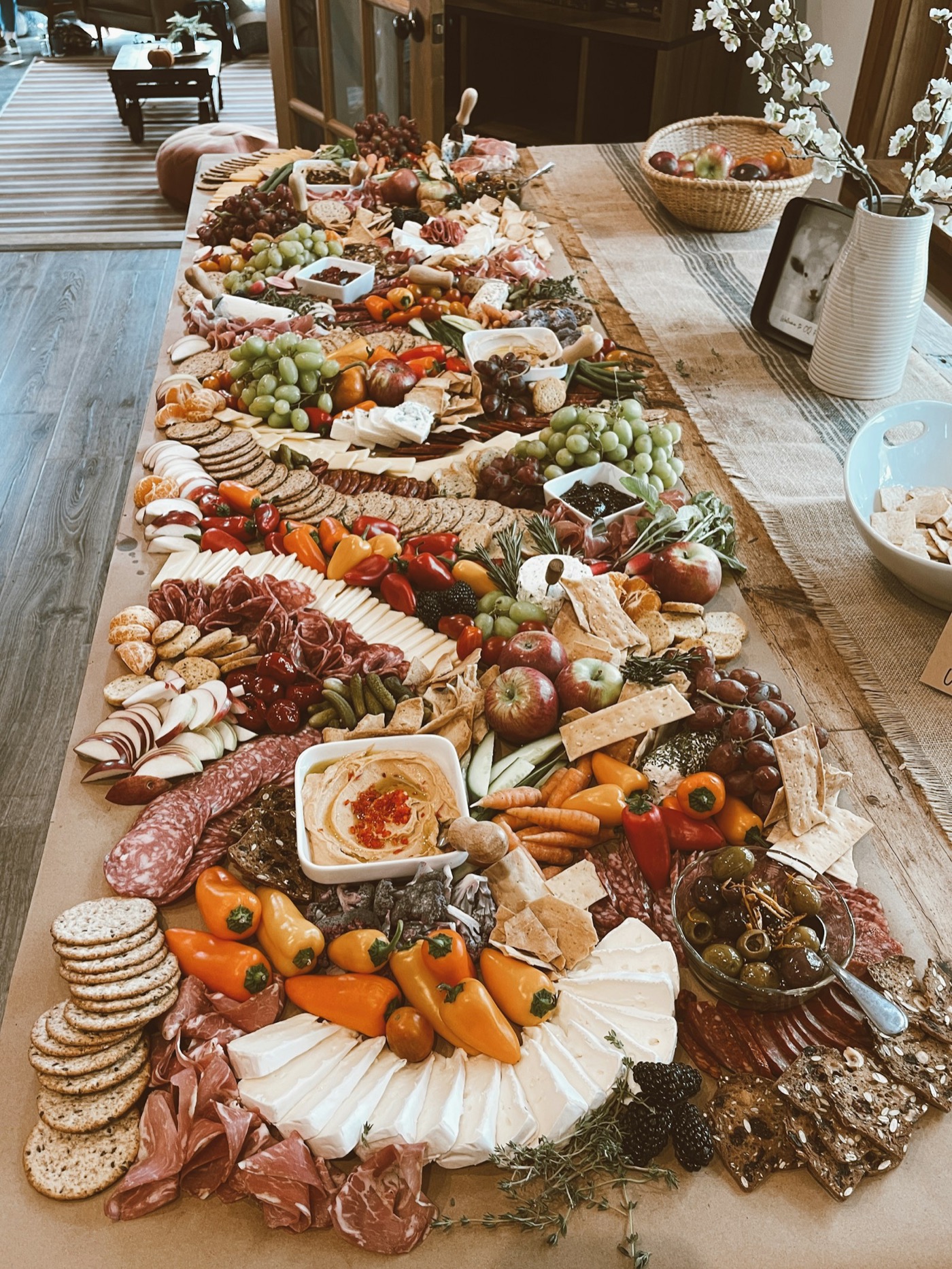 A wedding charcuterie spread with florals.